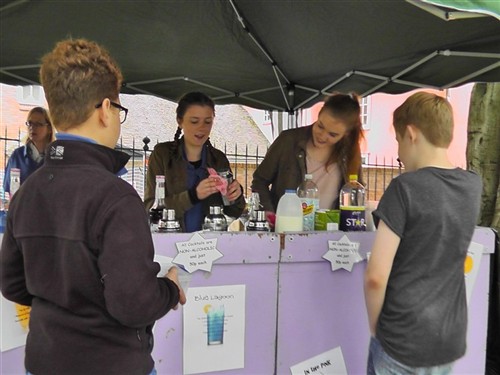 Young people running the fruit cocktail bar